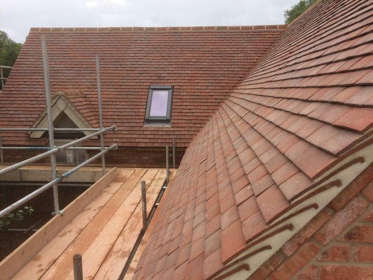 Traditional clay tile roof with Velux window